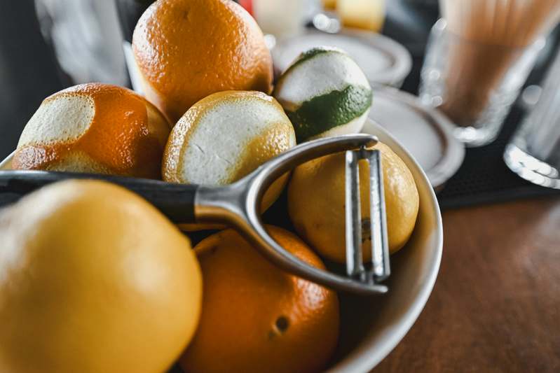 Assortment of high-quality potato peelers laid out on a light linen cloth with natural lighting
